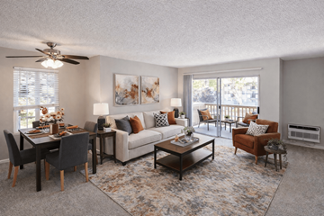 Fremont apartment for rent - A living room with a dining table set up with chairs around it.