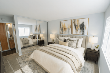 Belmont apartment for rent - A bedroom with a large bed and a painting on the wall.