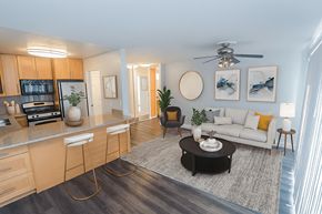 Belmont apartment for rent - A modern kitchen with a bar stool and a coffee table.