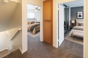 San Leandro apartment for rent - A bedroom with a bed and a dresser is shown.