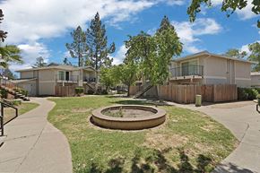 Fairfield apartment for rent - A sunny day at a residential area with a playground in the foreground.