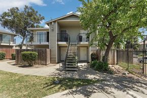 Fairfield apartment for rent - A tree is in front of a house.