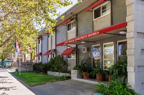 Concord apartment for rent - The front of a building with a red awning that says City Park Apartment Homes.