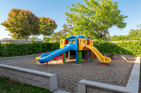 Newark apartment for rent - A colorful playground with a blue and yellow slide.