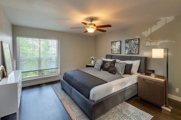 Fremont apartment for rent - A bedroom with a large bed and a ceiling fan.