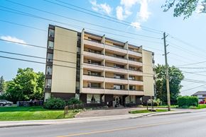 Lindsay apartment for rent - A large apartment building with multiple balconies and windows.