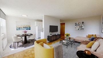 North York apartment for rent - A living room with a yellow chair and a couch.