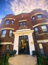 Toronto apartment for rent - A brick building with a black door and windows.