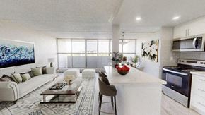 East York apartment for rent - A modern kitchen with a white color scheme and a dining area with a white couch and a coffee table.