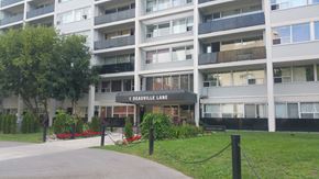 North York apartment for rent - A building with the name 1 Deauville Lane on it.