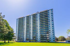 North York apartment for rent - A tall residential building with many windows and balconies.