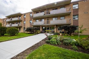 Orangeville apartment for rent - Apartment building with a walkway in front of it.