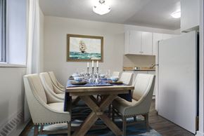 Brampton apartment for rent - A dining room with a wooden table and chairs.