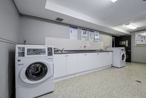 Toronto apartment for rent - A laundry room with a washing machine and a dryer.