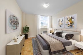 Toronto apartment for rent - A bedroom with a large bed and a painting on the wall.