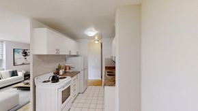 Brampton apartment for rent - A white kitchen with a white oven and white cabinets.