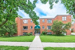 North York apartment for rent - A red brick building with the number 28 on the front.