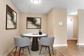 Scarborough apartment for rent - A dining room with a round table and grey chairs.