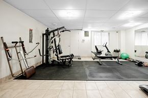 London apartment for rent - A gym room with a variety of exercise equipment.