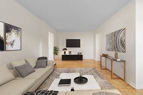 Toronto apartment for rent - A living room with a couch, coffee table, and a television.