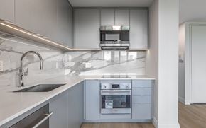 Toronto apartment for rent - A modern kitchen with a stainless steel oven and sink.