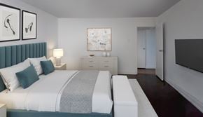 Toronto apartment for rent - A bedroom with a bed, a nightstand, and a dresser.