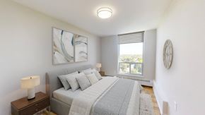Thornhill apartment for rent - A bedroom with a large bed and a painting on the wall.