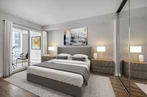 Toronto apartment for rent - A modern bedroom with a large bed and a painting on the wall.