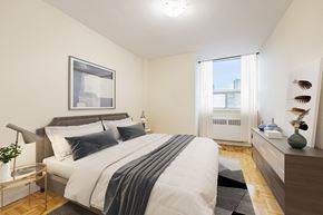 East York apartment for rent - A bedroom with a large bed and a window with white curtains.