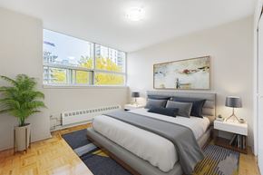North York apartment for rent - A bedroom with a large bed and a painting on the wall.
