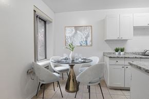 Toronto apartment for rent - A dining area with a round table and chairs.