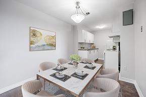London apartment for rent - A dining room with a table set for four.
