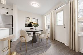 Scarborough townhouse for rent - A dining room with a round table and chairs.