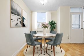 East York apartment for rent - A dining room with a table and chairs.