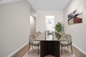 London townhouse for rent - A dining room with a table and chairs.