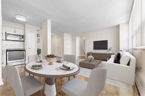 North York apartment for rent - A modern dining room with a round table and grey chairs.