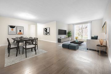 London apartment for rent - A modern living room with a dining table and chairs.