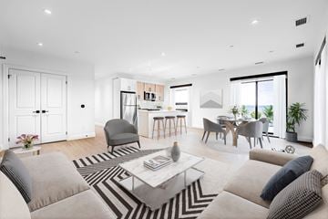Waterloo apartment for rent - A modern living room with a black and white striped rug and grey couches.