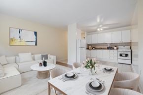 North York apartment for rent - A modern dining room with a white table set for four.