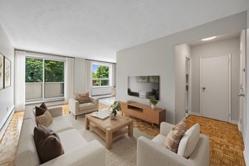 Brampton apartment for rent - A living room with a couch, a coffee table, and a television.