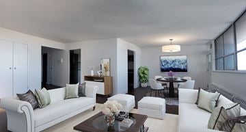 Toronto apartment for rent - A modern living room with a white sofa and a coffee table.