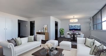 Toronto apartment for rent - A modern living room with a white sofa and a coffee table.