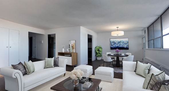 Toronto apartment for rent - A modern living room with a white sofa and a coffee table.