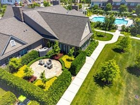 Novi apartment for rent - an aerial view of a house with a yard and a swimming pool
