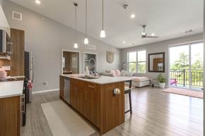 Walled Lake apartment for rent - a kitchen and living room in a new home