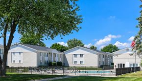 Sterling Heights apartment for rent - A row of houses with a pool in front.