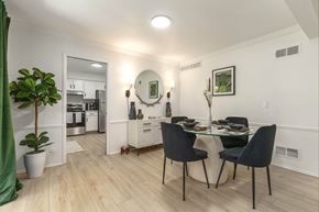 Farmington Hills townhouse for rent - a living room and dining room with a table and chairs