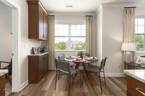 Novi apartment for rent - a dining room with a table and chairs in front of a window