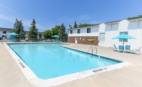 Saginaw apartment for rent - A swimming pool with blue water and white lane markers.