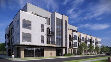 Royal Oak apartment for rent - A modern building with a white and black exterior and large windows.